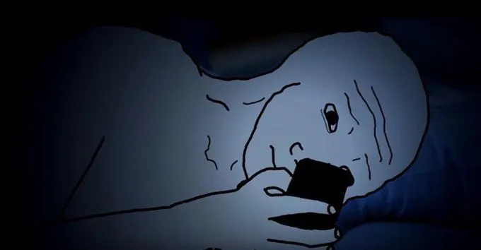 Wojack laying in bed with phone screen glowing. He looks upset.
